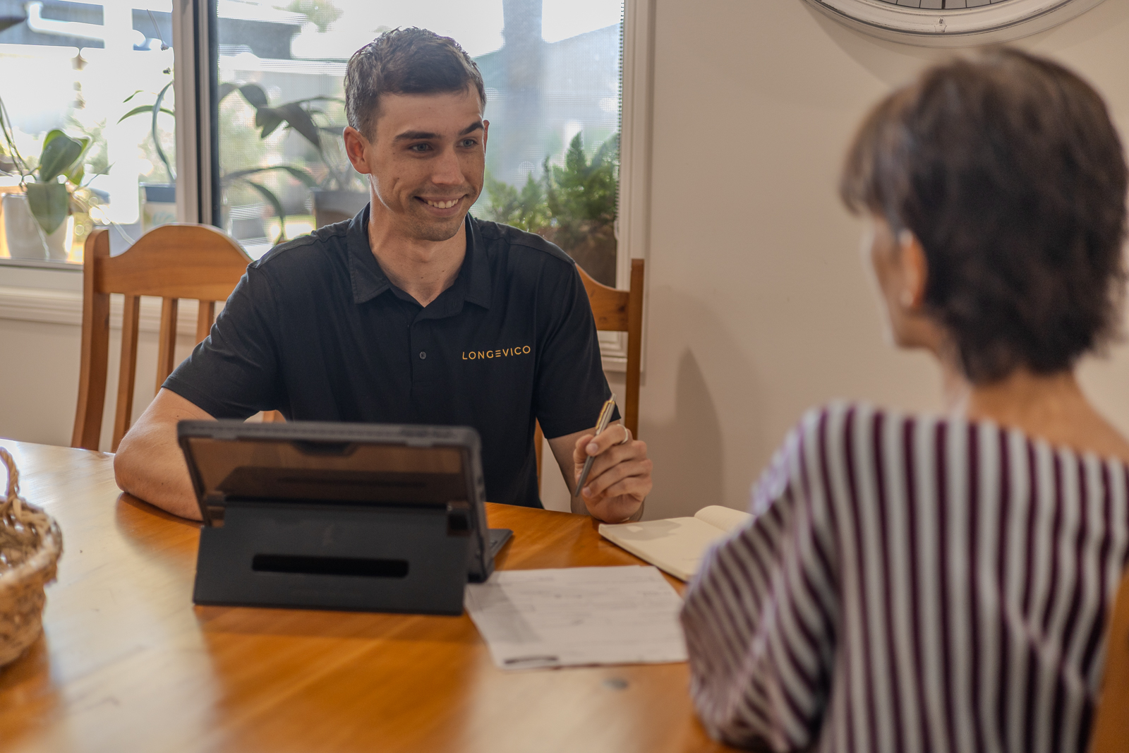Longevico Exercise Physiologist completing an initial health consult at a client’s home