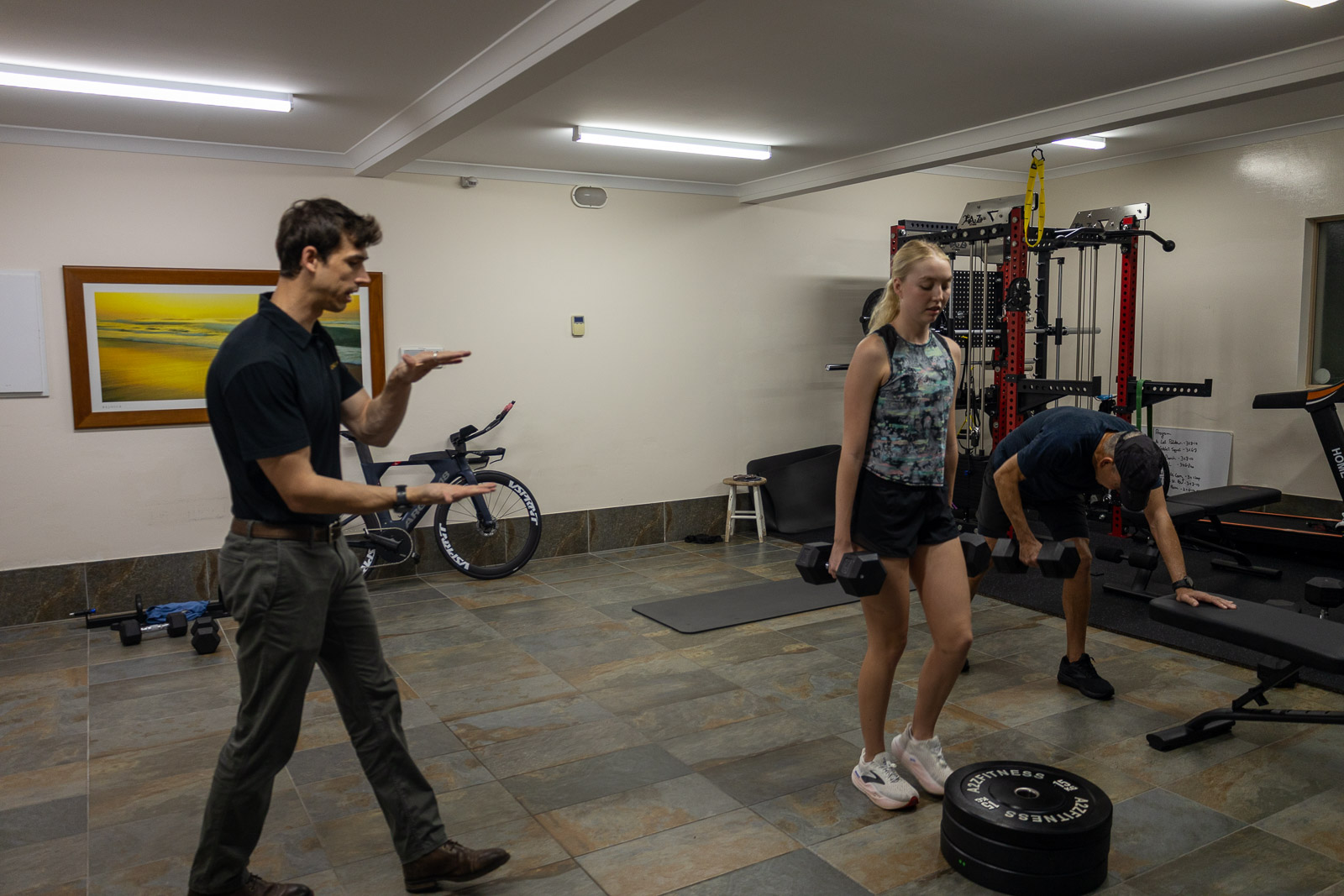 Movement rehabilitation session with supervised lower limb exercise support.