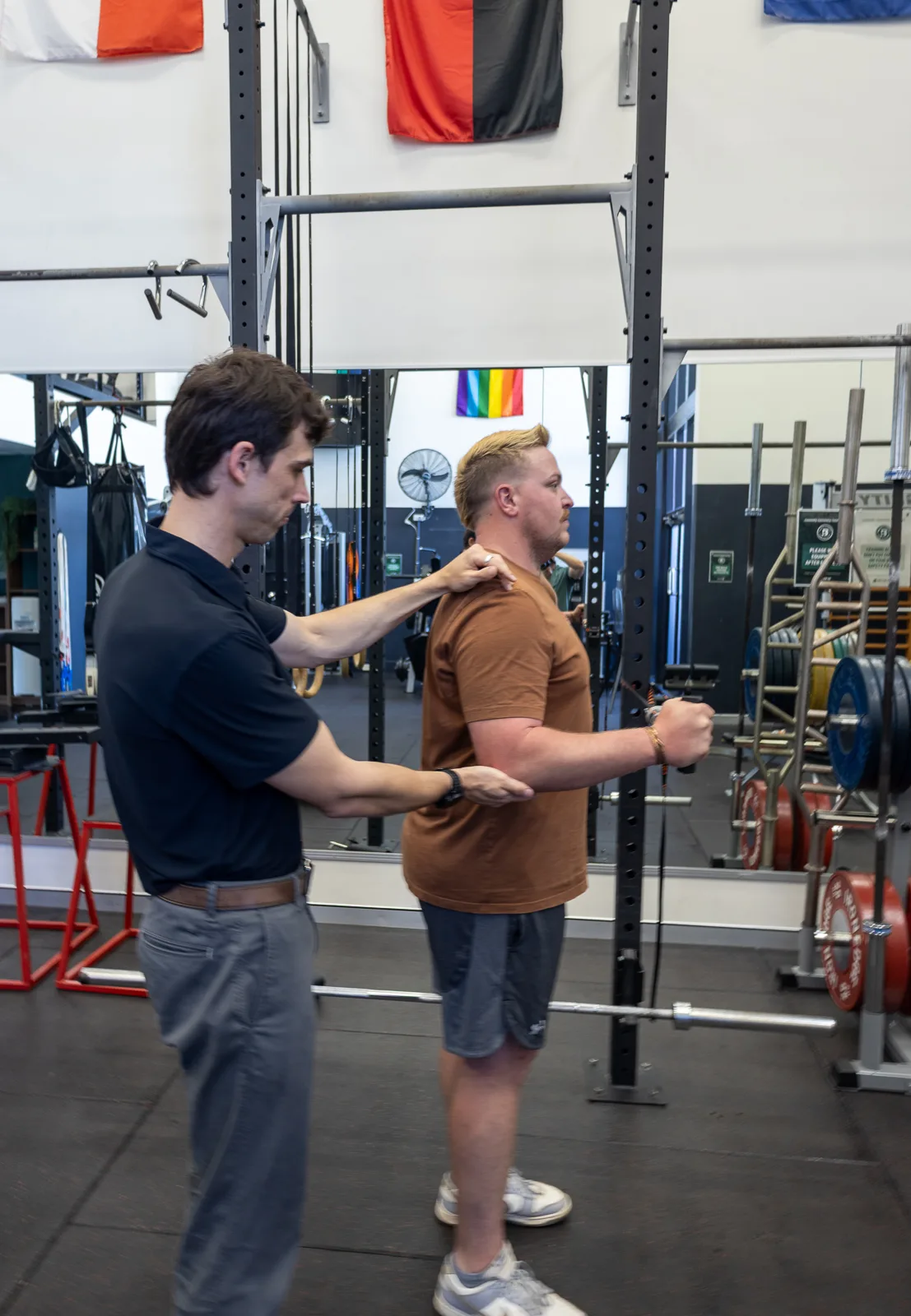 A clinician assessing shoulder movement