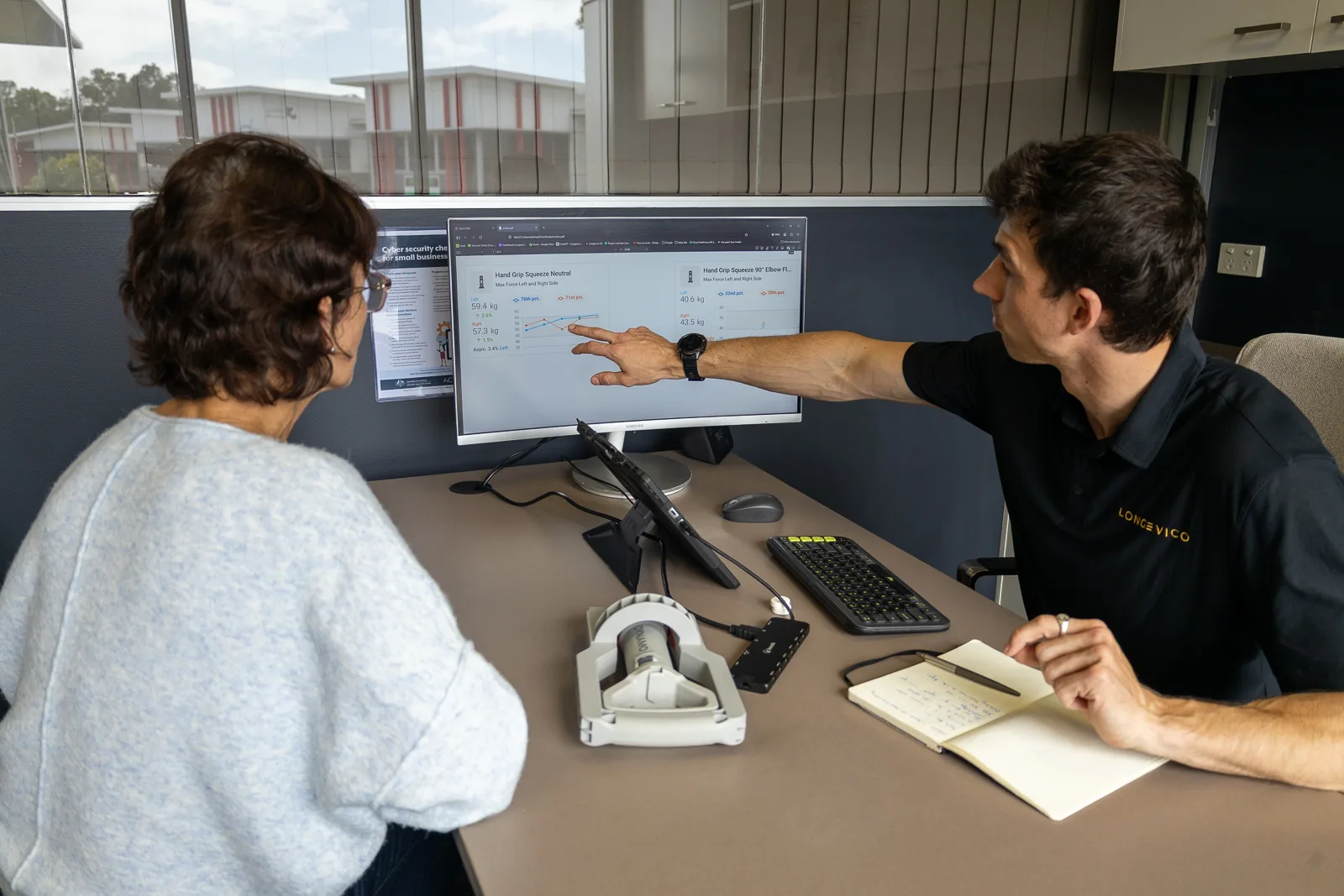 A Longevico clinician discussing an integrated health report